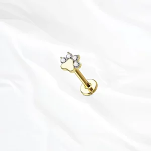 Piercing labret en titane doré "la pattoune" motif patte d'animal sertie de zircons clairs pour hélix ou tragus