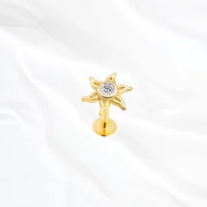 Piercing labret en titane doré motif fleur soleil (sunburst) avec zircon central pour tragus ou conch