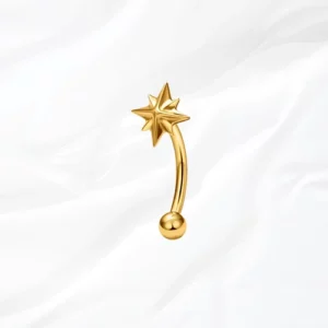 Piercing banane en titane doré "l'étoile montante courbée" avec motif étoile polaire pour rook ou arcade