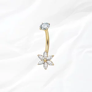 Piercing de nombril banane en titane doré "Lily" motif fleur à 6 pétales en cristaux marquise clairs