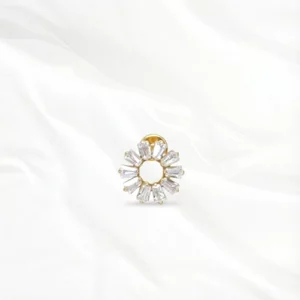 Piercing titane doré "la roue ensoleillée" motif soleil avec cristaux taille baguette