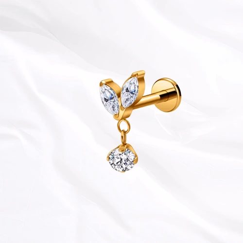 piercing labret en titane doré, deux zircons marquise et pendentif serti d'un zircon rond