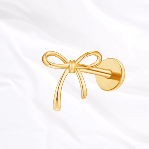 piercing labret en titane doré en forme de nœud de lacet