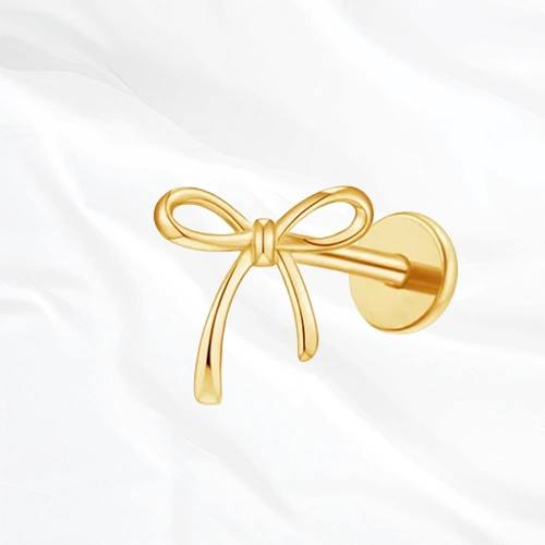 piercing labret en titane doré en forme de nœud de lacet