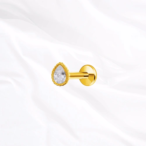 Labret push-in en titane doré L’Obélisque, zircon taille poire serti clos dans une monture bordée de fines billes