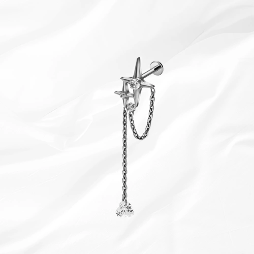 Labret en titane argenté La Grande Constellation, étoile sertie et chaînette doublée jusqu’à un zircon poire suspendu