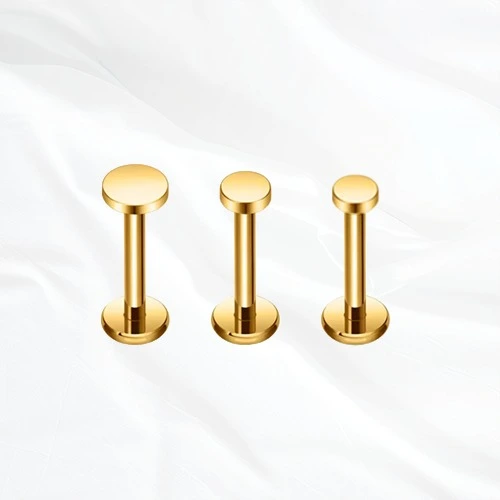 Trois labrets en titane Le Commun dorés, plateau plat rond en 2,5, 3 et 4 mm