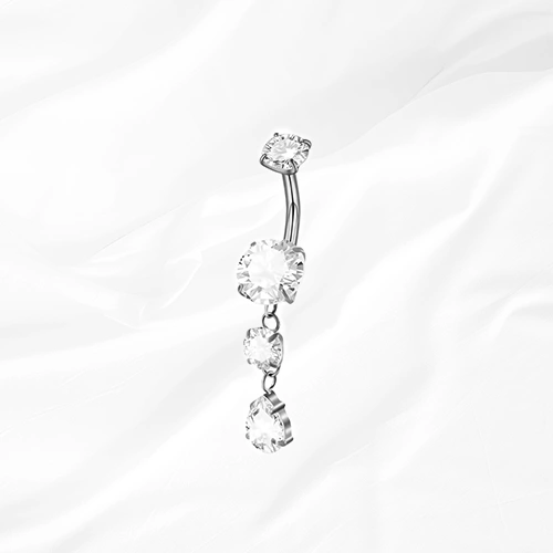 Piercing de nombril banane en titane argenté La Cascade Précieuse, trois zircons suspendus en cascade