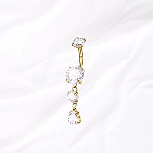 Piercing de nombril banane en titane doré La Cascade Précieuse, trois zircons suspendus en cascade
