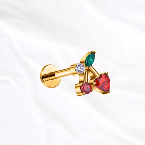 Labret en titane doré La Cerise, deux cerises serties de zircons rouges et feuille verte
