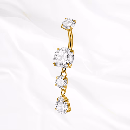 Piercing de nombril banane en titane doré La Cascade Précieuse, trois zircons suspendus en cascade