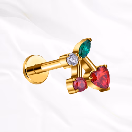 Labret en titane doré La Cerise, deux cerises serties de zircons rouges et feuille verte