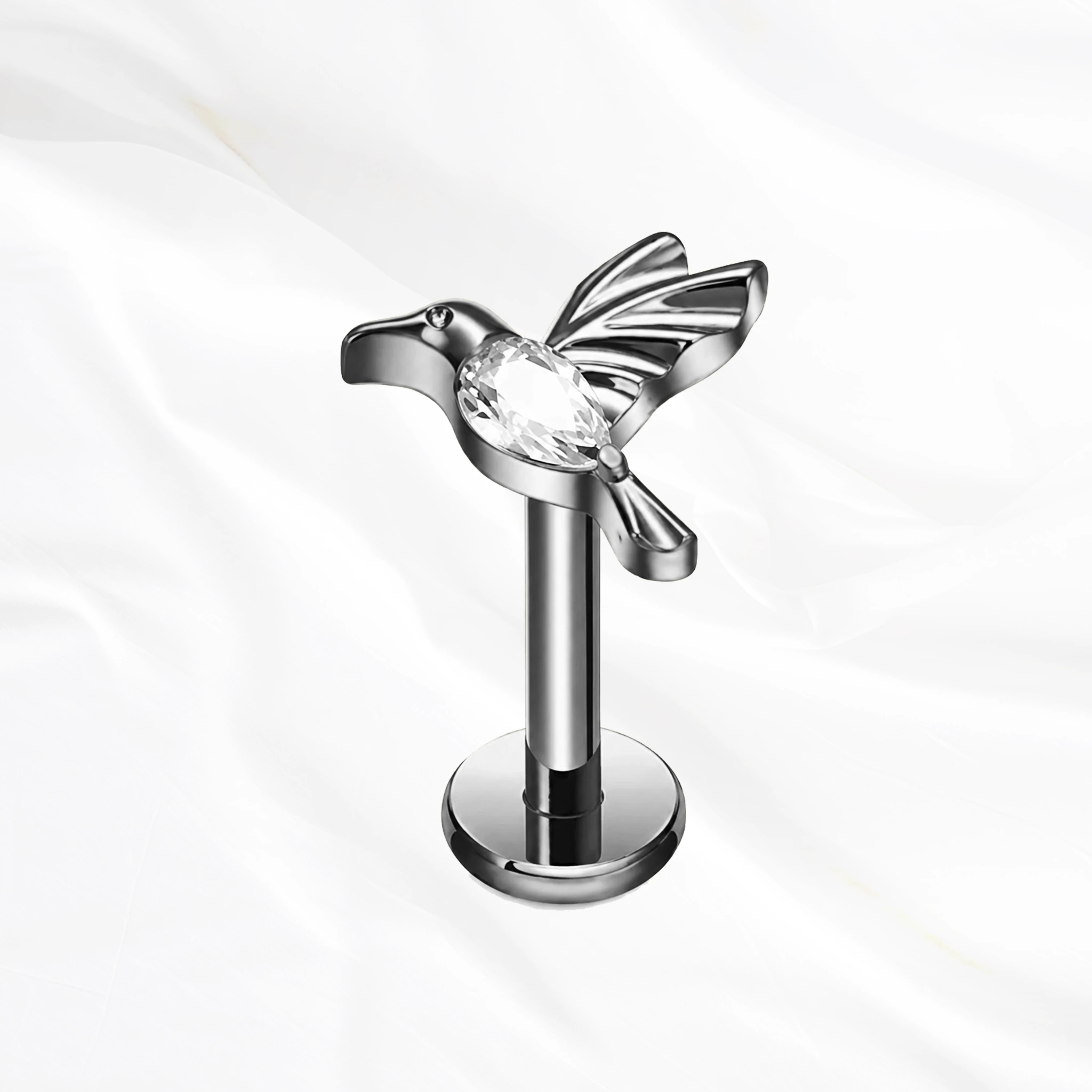 Labret en titane argenté Le Colibri, colibri en plein vol dont le corps entier est un zircon taille poire