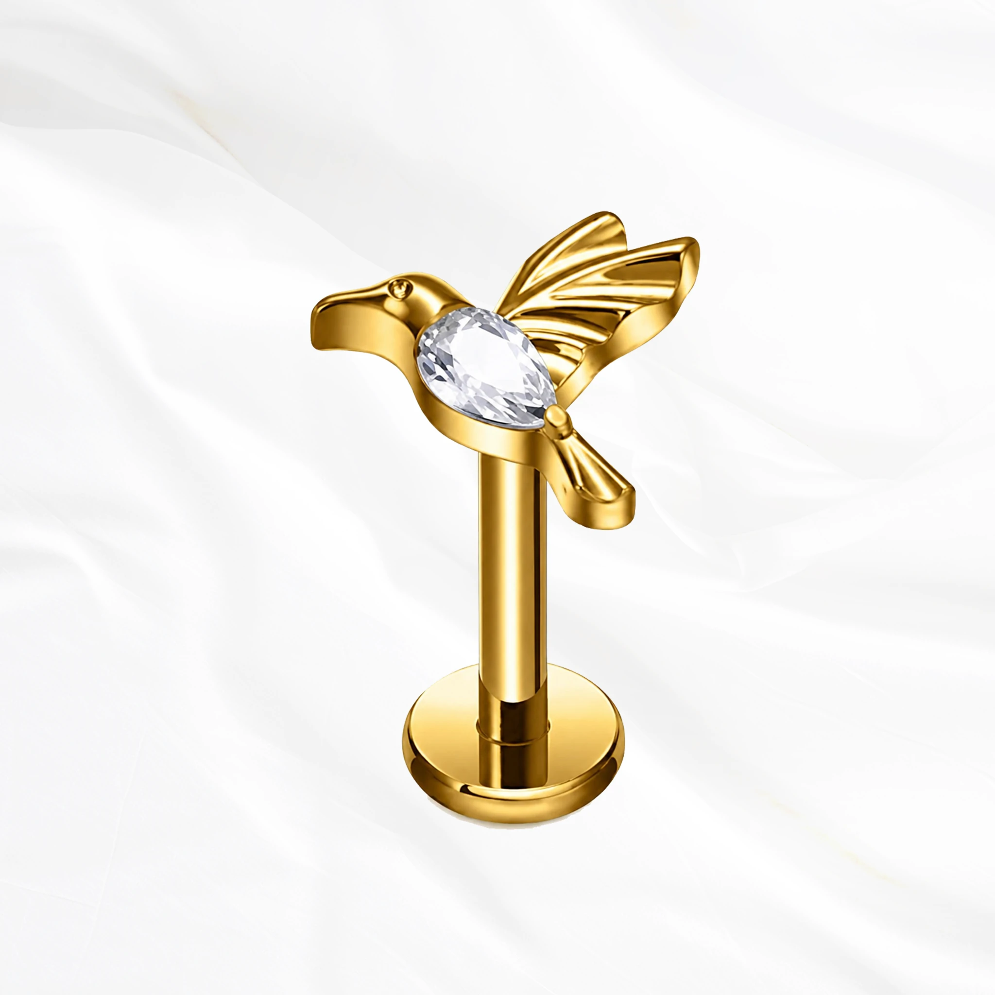 Labret en titane doré Le Colibri, colibri en plein vol dont le corps entier est un zircon taille poire