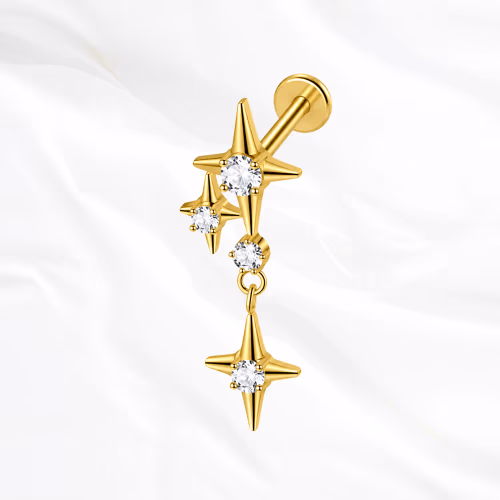 Labret en titane doré La Constellation, deux étoiles à quatre branches serties reliées par deux petites pierres