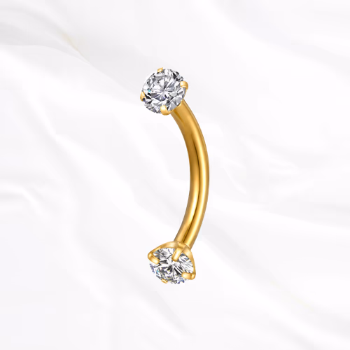 Barre courbée en titane doré La Courbe Sertie, un zircon rond serti à chaque extrémité