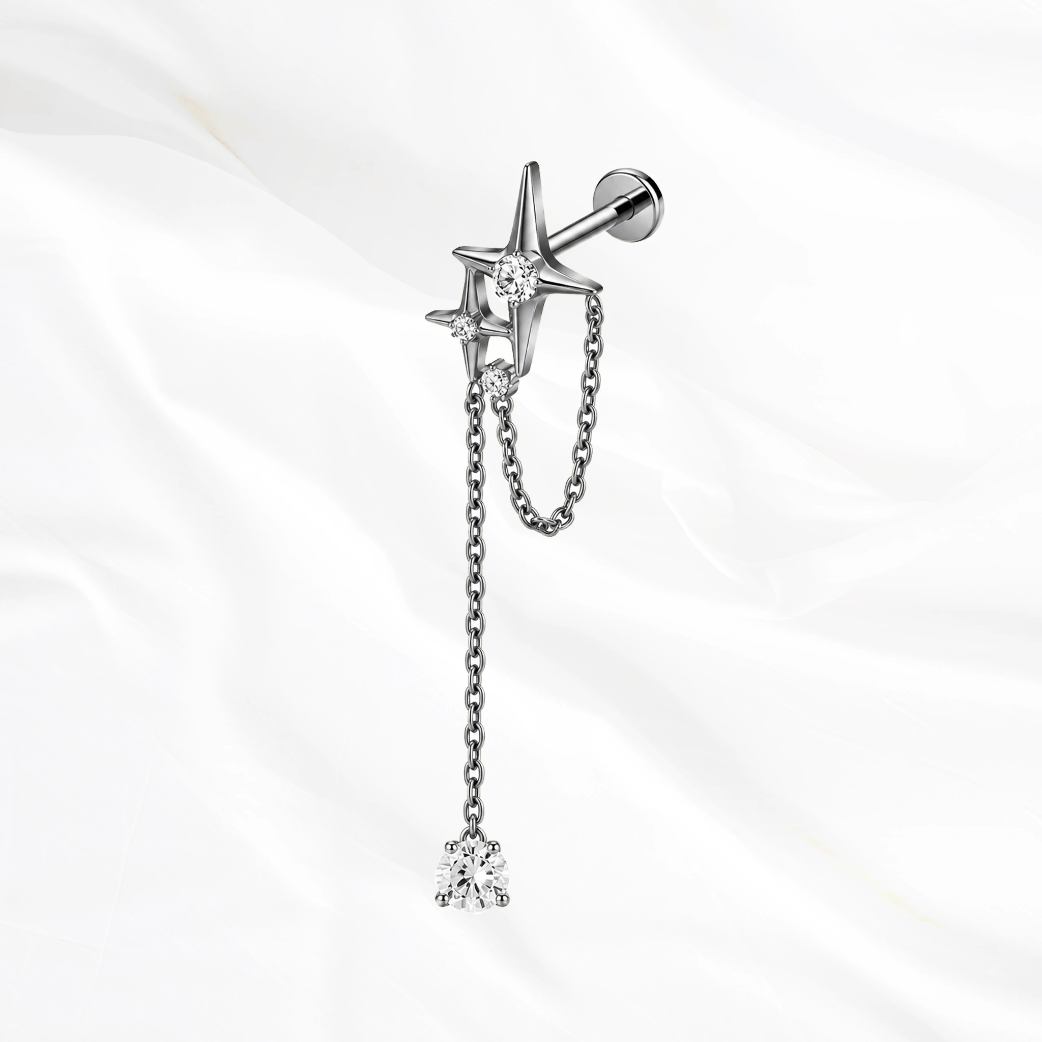 Labret en titane argenté La Grande Constellation, étoile sertie et chaînette doublée jusqu’à un zircon poire suspendu