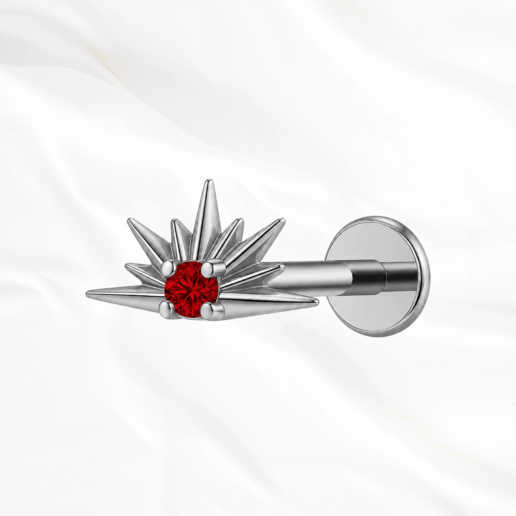 Piercing labret titane argenté "le lever du soleil" motif soleil levant rayonnant avec cristal zirconium rouge