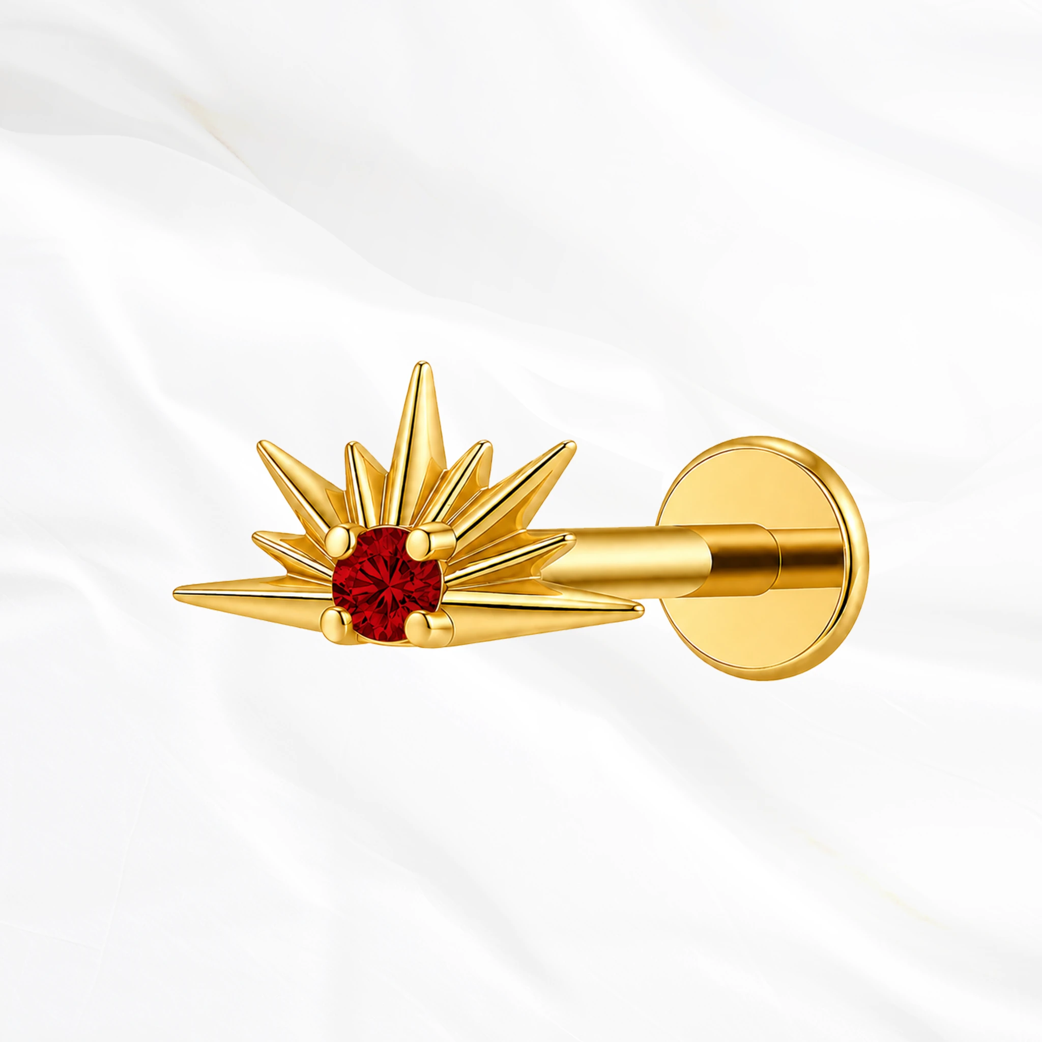 Piercing labret titane doré "le lever du soleil" motif soleil levant rayonnant avec cristal zirconium rouge