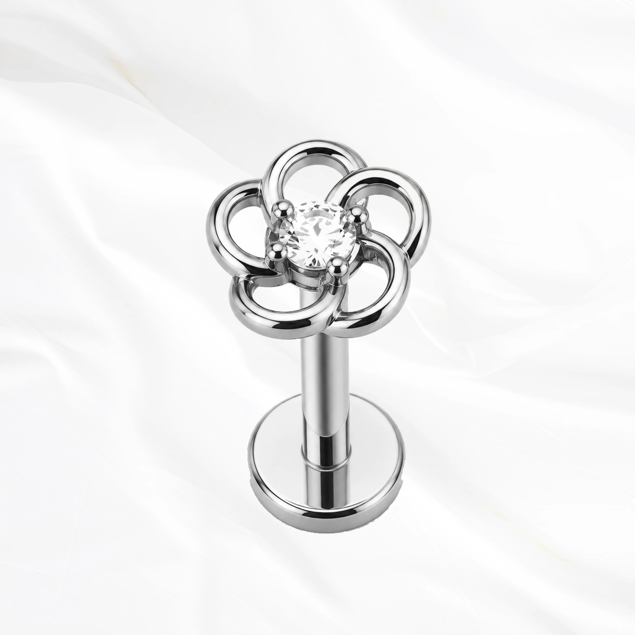 Labret push-in en titane argenté La Marguerite, cinq pétales ajourés en fil de titane autour d’un zircon