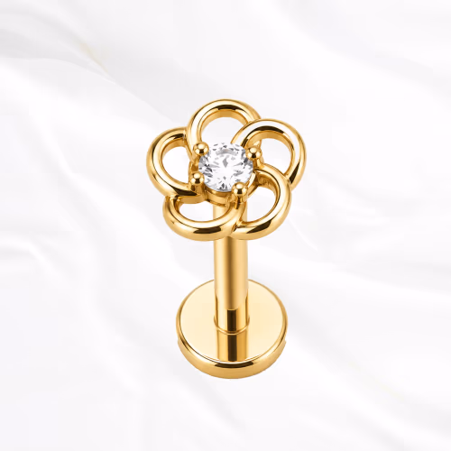 Labret push-in en titane doré La Marguerite, cinq pétales ajourés en fil de titane autour d’un zircon