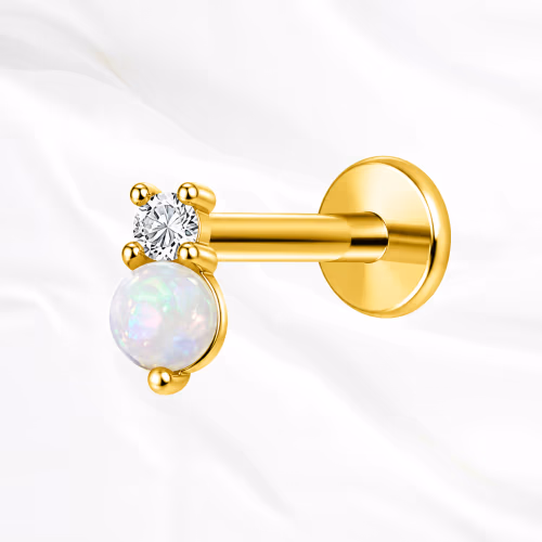 Labret push-in en titane doré Le Nacre, un zircon facetté et une perle d’imitation blanche et opalescente côte à côte