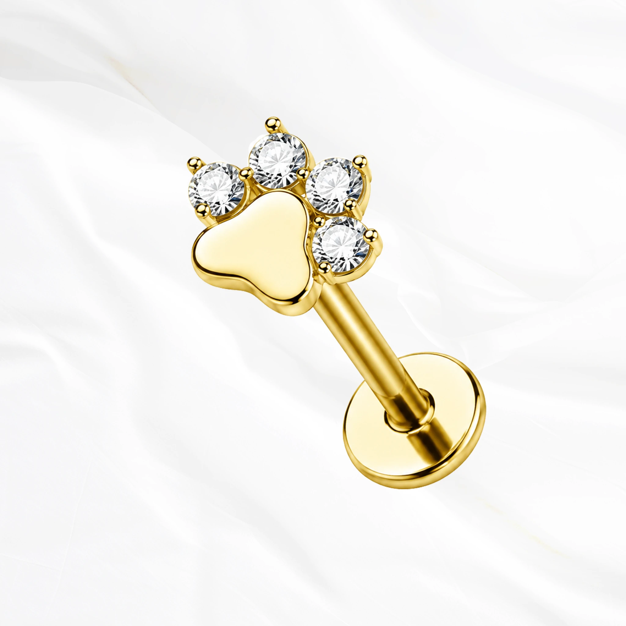 Labret push-in en titane doré La Pattoune, empreinte de patte à coussinet plein et quatre doigts formés de zircons