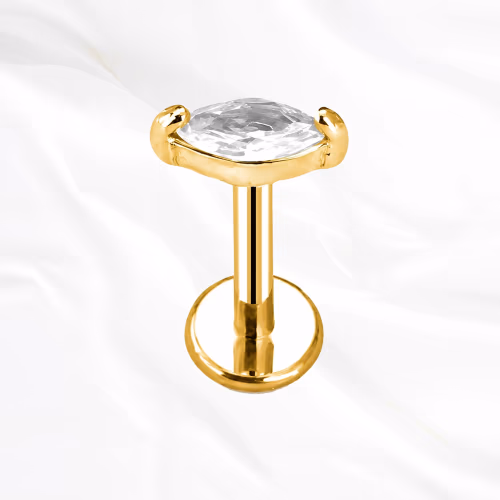 Labret en titane doré La Pierre, unique zircon taille marquise monté à plat et tenu par quatre griffes