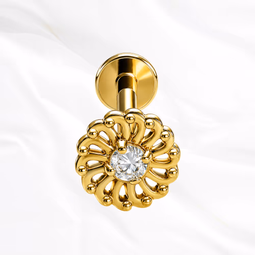 Labret push-in en titane doré La Rosace Brillante, zircon central cerné d’une couronne de pierres plus petites dans une monture perlée