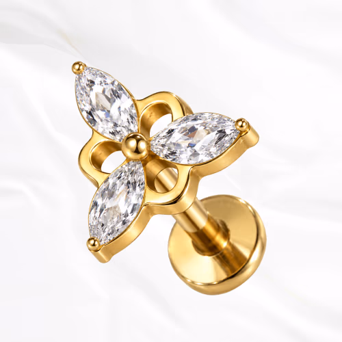 Labret en titane doré La Triforce V2, trois zircons marquise en étoile autour d’une perle de titane, monture ajourée en trèfle